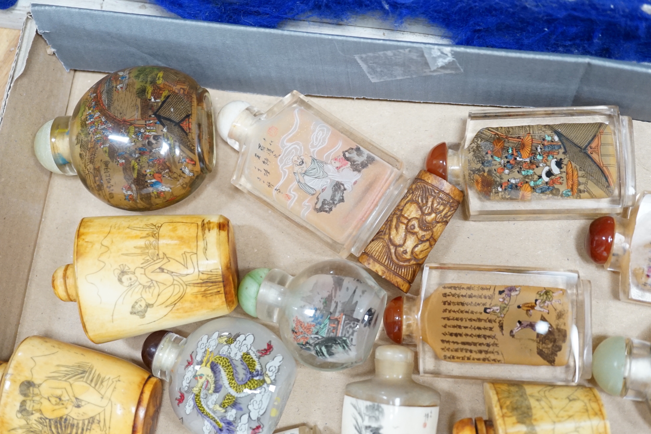 A collection of Chinese snuff bottles, mostly reverse painted (2 trays)